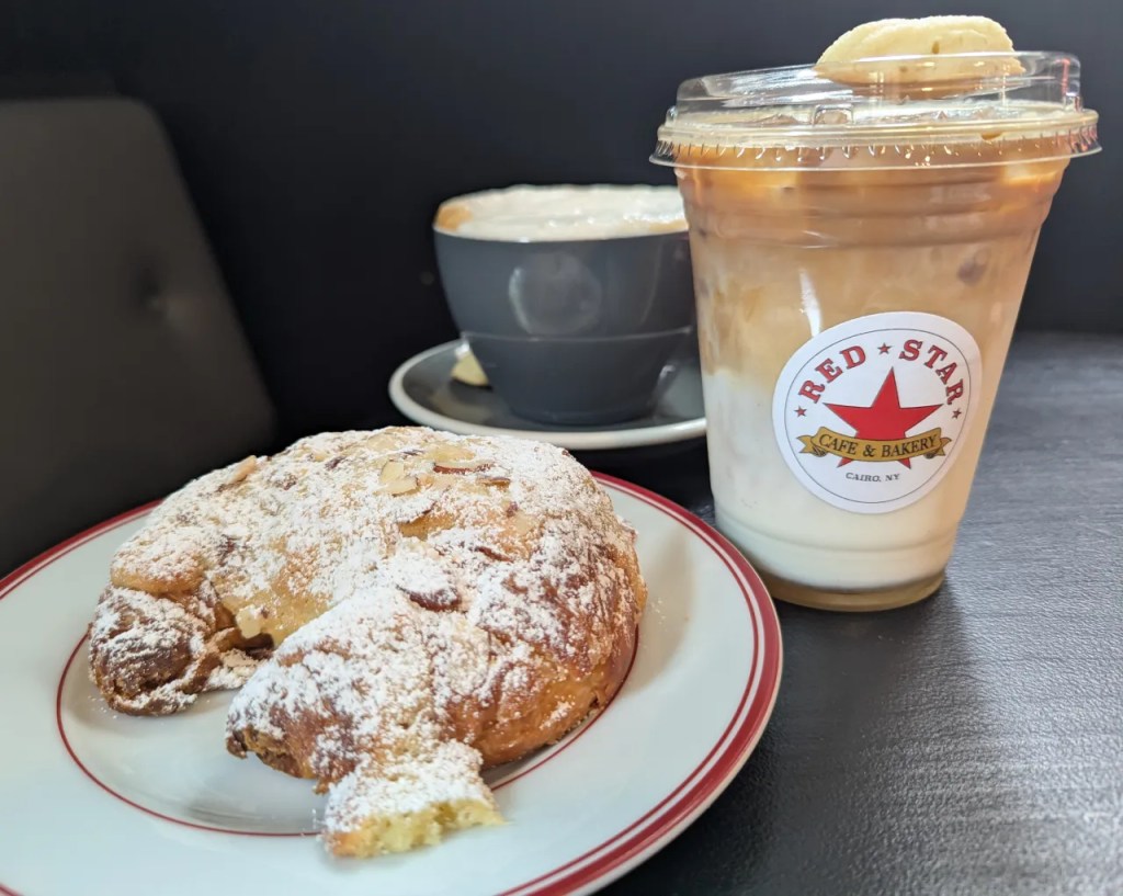 Red Star, Cairo - Almond Croissant, Iced Latte, Hot Latte with sweet foam. 
