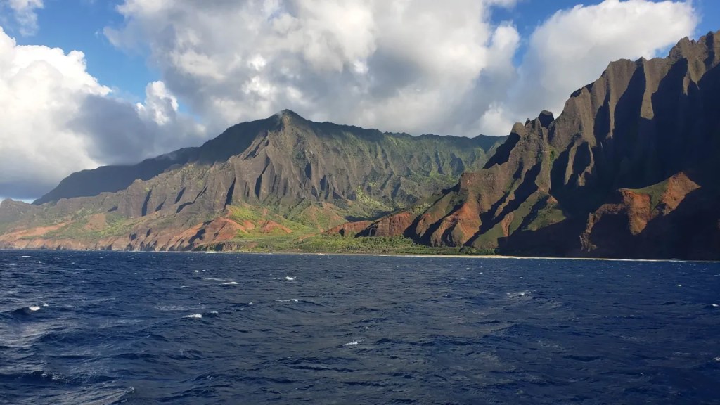 View of western part of Kauai from sunset cruise boat