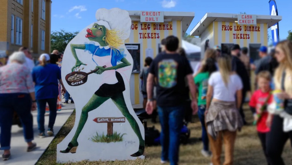 Buying dinner tickets at the Fellsmere Frog Leg Festival.
